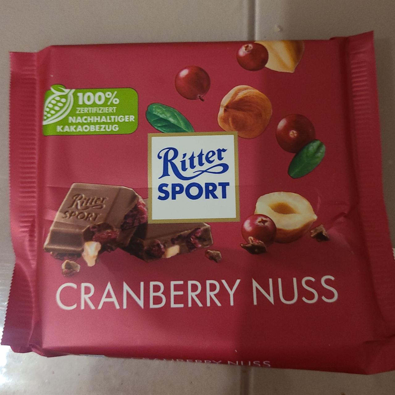 Фото - Шоколад молочный с кусочками клюквы и орехом лещины Cranberry Nuss Ritter sport